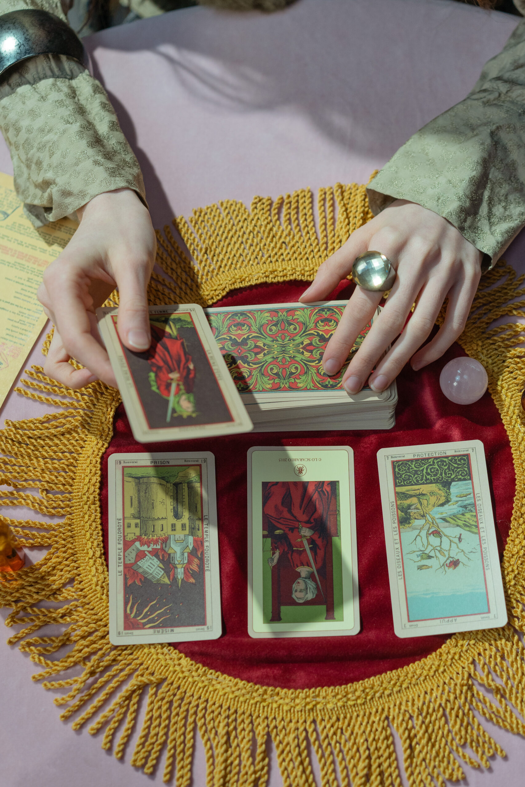 A person holding tarot cards